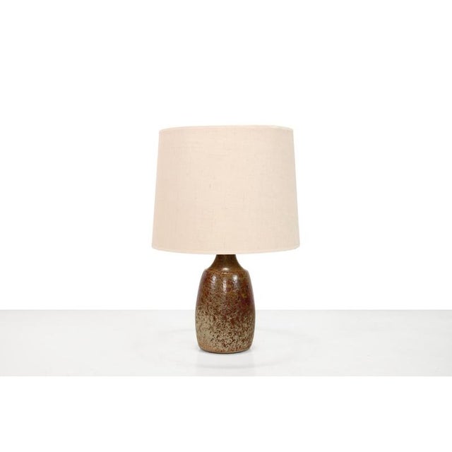 A beautiful, large ceramic table lamp by Frank Milo for Tromborg, Denmark. This model, 566, is glazed in shades of brown,...