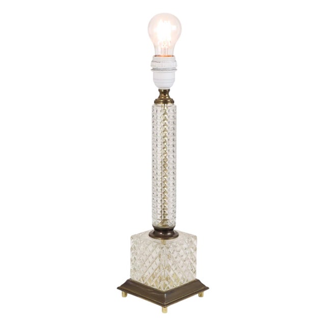 Vintage classic table lamp—a column-style lamp made of glass and copper-plated metal—manufactured around the 1980s by...