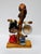 Handcrafted solid wood mug tree with a beautifully figured natural wood base and an unusual burl-like crown. The flowing...
