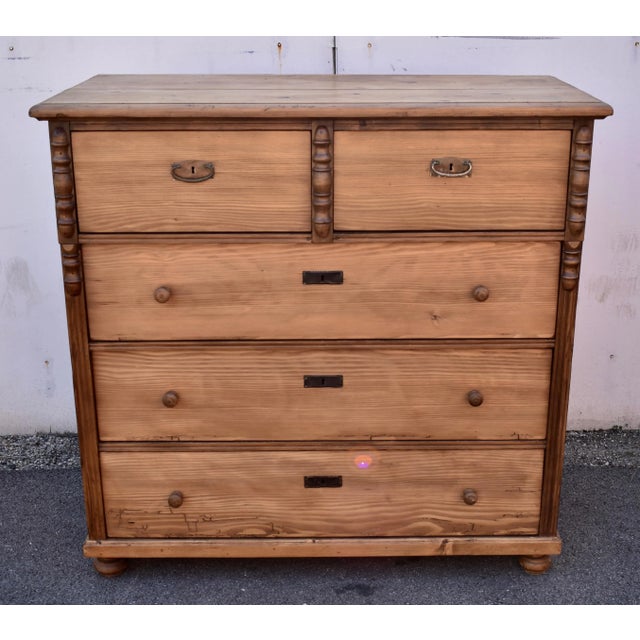 This splendid five drawer chest has a bold step-down edge to its thick top. The first tier comprises two short, deep...