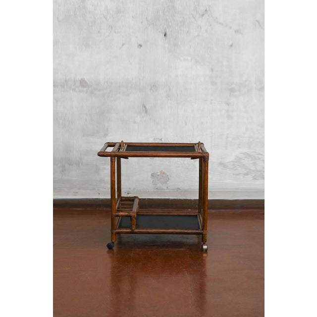 Wicker trolley with double shelf, glass tray and bottle holder Dimensions 73 W x 67 H x 52 D cm