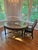 Chairs: This piece seamlessly blends British Colonial charm with exotic island elegance, featuring a handcrafted rattan...