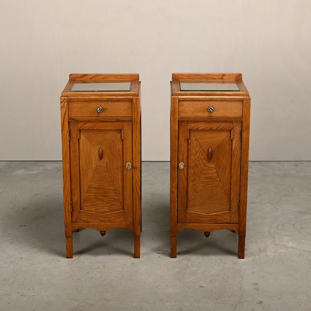 Pair of Art Deco bedside tables or bedside tables in the style of the Amsterdam School, Netherlands, 1930s. Solid oak...