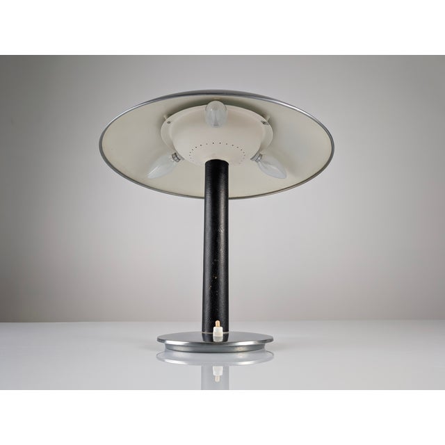 Exclusive Metalarte table lamp from 1962, a true gem that encapsulates the rich history of one of the pioneering firms of...