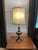 Elevate your interior with this exceptional pair of mid-century table lamps manufactured by the renowned Rembrandt Lamp...