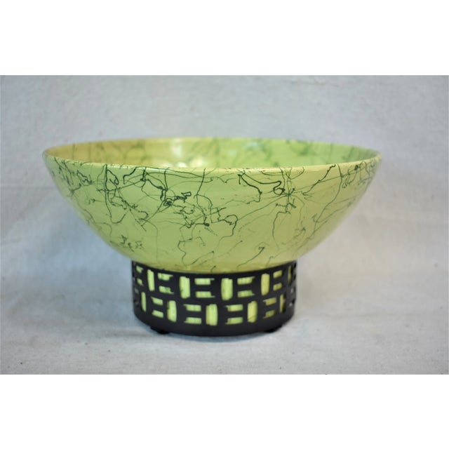 Vintage Mid-Century chartreuse with black spatter bowl with a black metal stand that fits the bottom of the bowl. This is...