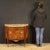 A half-moon dresser, early 20th-century France. A Louis XVI-style furniture finely inlaid with walnut, mahogany, maple,...