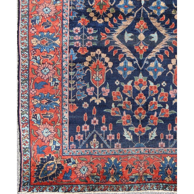 Antique Persian Tabriz Carpet with Botanical Elements in Navy Blue, Red-Orange Antique Persian Tabriz Carpet with...