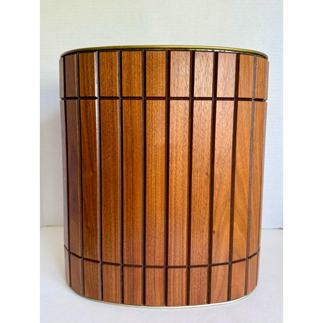 Here is a handsome vintage wastebasket by Ransburg, dating to about the 1960s. The oval form features an exterior wrapped...