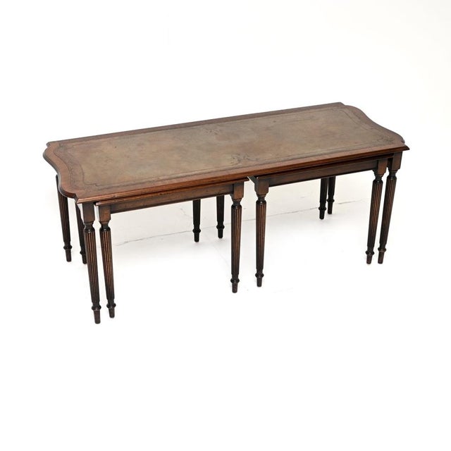A wonderful antique leather top nesting coffee table / side tables. These were made in England, they date from around the...