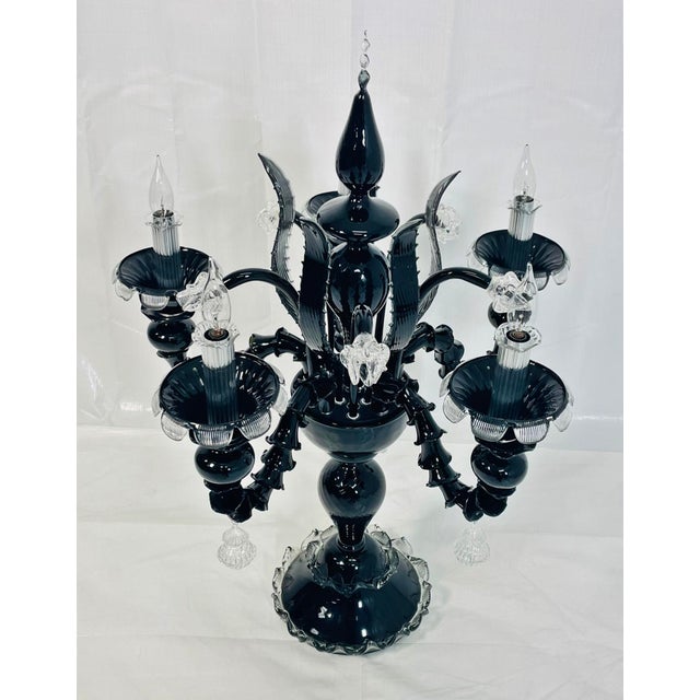 A rare, museum-scale Murano glass candelabra with exceptional provenance, sculptural presence, and dramatic impact. This...
