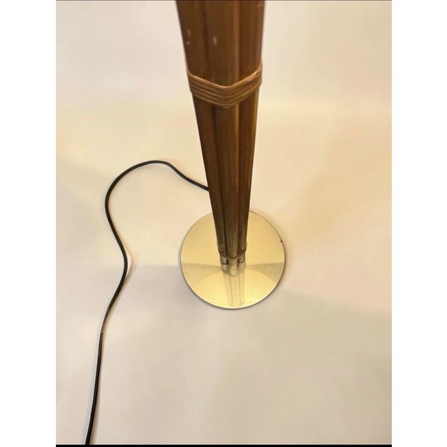 This vintage bamboo brass floor lamp from the 1960s stands at 5 feet tall and features a large shaded design. The lamp is...