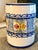 A charming vintage ceramic hand painted vessel with multiple possible uses, utensil holder, vase, wine bottle holder, etc....