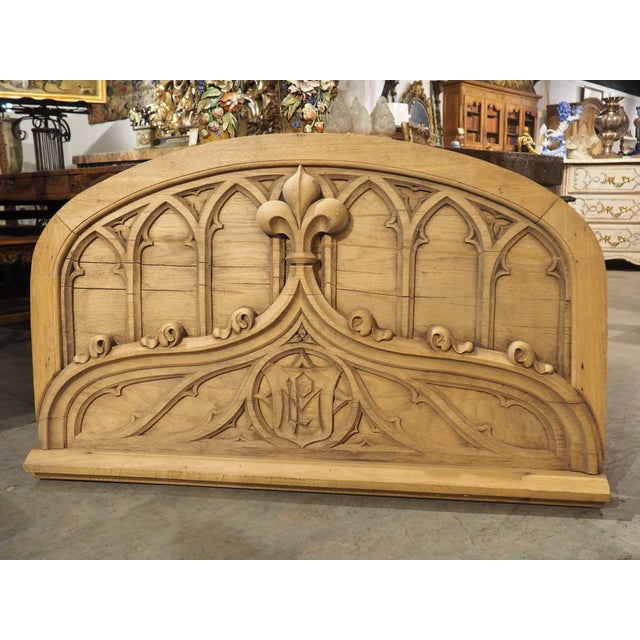 These Gothic-style carvings of this French overdoor are quite masterful, most noticeably the depth, such as the fleur de...