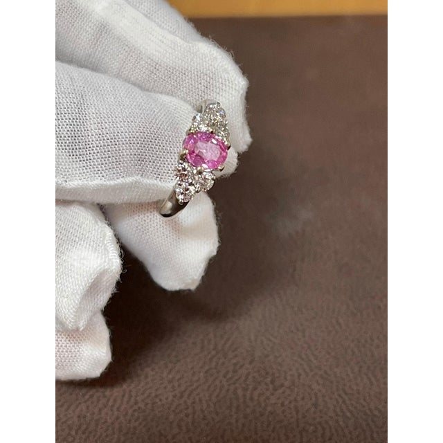 A classic, Ring 0.75 Ct Oval Pink Sapphire & 0.50 Ct Diamond Ring in 18 Karat White gold. Natural Pink Sapphire in Oval...