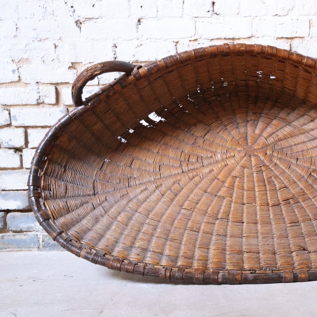 20th-century French bakery basket crafted from handwoven wicker. Light and airy with timeless charm, it's perfect for...
