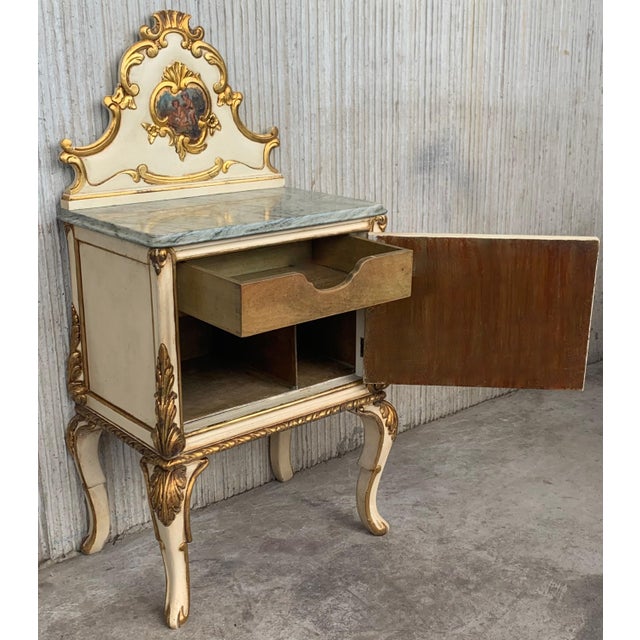 Pair of Cream White Neoclassic nightstands with beautiful light green marble top. The tables have a gilt wood decoration...