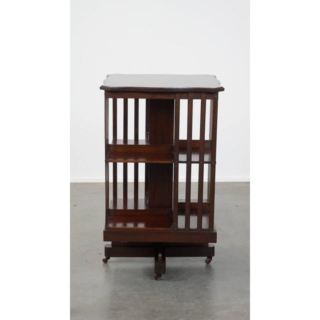 Luxurious antique English wooden book mill on wheels from the late 19th century. This nice English antique book mill can...