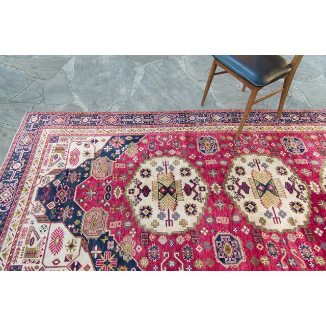 A vintage hand-knotted Anatolian rug that catches the eye with its bold colors and various shaped/sized medallion designs...