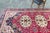 A vintage hand-knotted Anatolian rug that catches the eye with its bold colors and various shaped/sized medallion designs...