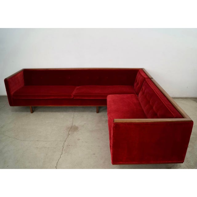 Vintage 1960's Mid Century Modern sectional couch for sale. It's a two-piece sectional that has a solid walnut platform...