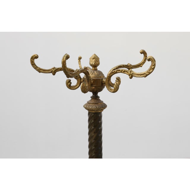 An elegant French coat stand from the early 20th century, crafted in the Napoleon III / Belle Époque style. The piece...