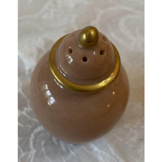 Fitz and Floyd Versailles Salt And Pepper Shaker Set In Dusty Rose. Good condition. Some wear on the gold top, see photo....