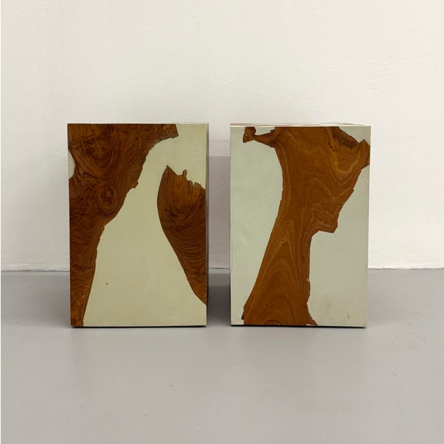 A sculptural pair of vintage pedestal tables featuring richly figured burl wood veneer contrasted with glossy lacquered...