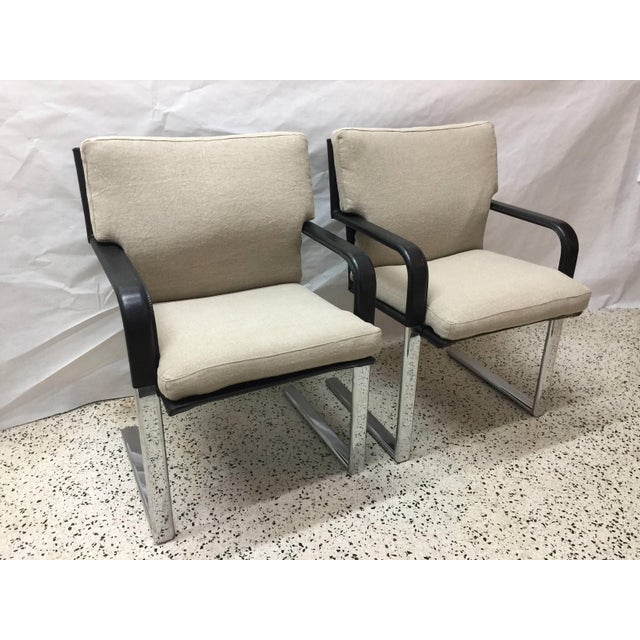 A very comfortable set of black stitched leather chairs by Matteo Grassi. Steel frame with chromed steel handle on...