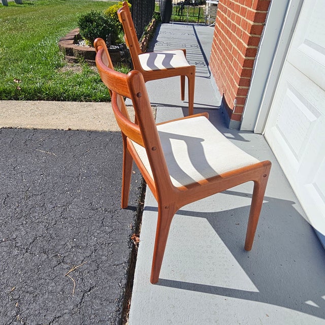 These 4 well-crafted teak dining chairs in timeless Danish modern style manufactured by Sun Furniture, Thailand for KD...