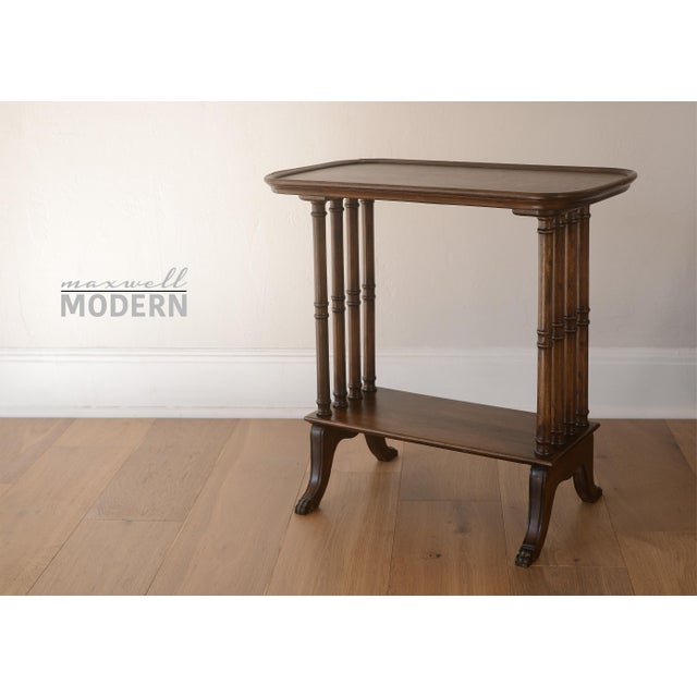 Elegant vintage Victorian mahogany side table with legs capped with brass lion feet.
