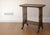 Elegant vintage Victorian mahogany side table with legs capped with brass lion feet.