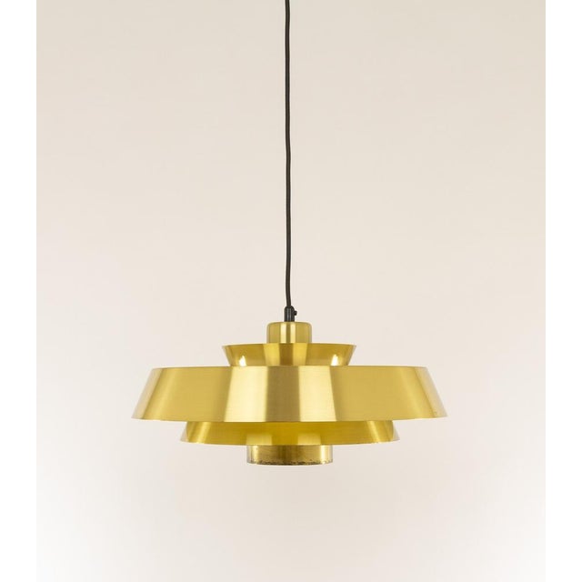 Brass Nova pendant designed in the 1960s by Jo Hammerborg, main designer of Danish lighting manufacturer Fog & Mørup in...