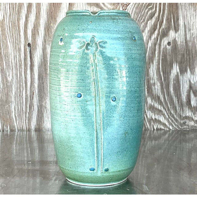 This stunning vintage Boho studio pottery vase features a calming teal glaze with subtle textured details and an elegant...