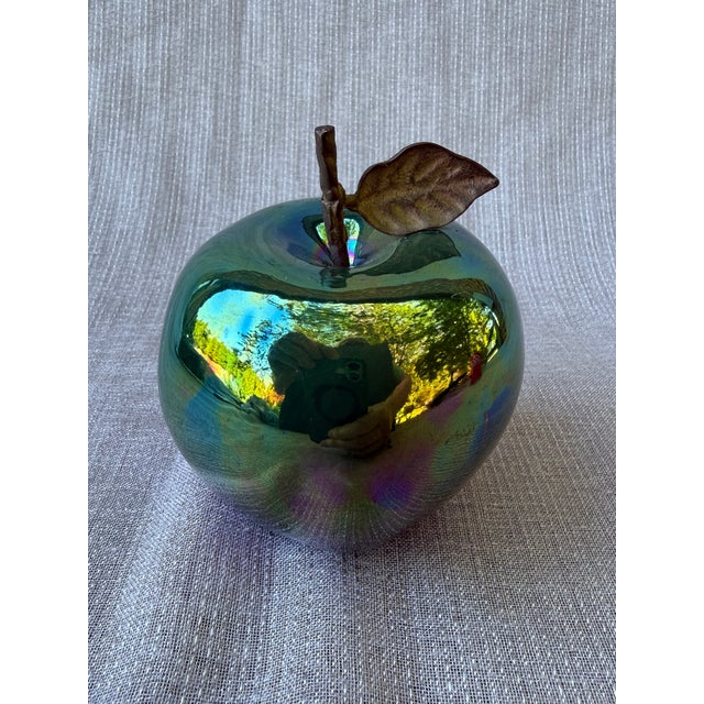 Vintage artisan made glossy green pottery apple sculpture with textured metal stem and leaf. Signed on the bottom. Has a...