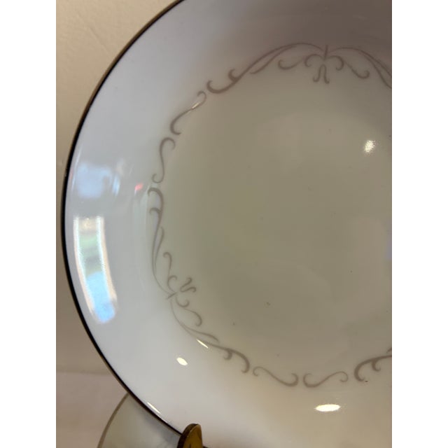 A generous set of 12 bowls in the Trianon pattern by Kimberly Fine China, Japan. Each bowl features a delicate platinum...