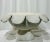 A wonderfully tactile, sculptural concrete planter with a distinctly folk art sensibility. The bowl is ringed with a hand-...