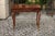 An Italian walnut quarter-veneered side table from the late 18th century, with single drawer and cabriole legs. Born in...