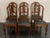 6 Art Deco chairs, leather seat. Walnut feather veneer back and fan-shaped selvage. The richly carved legs start with a...