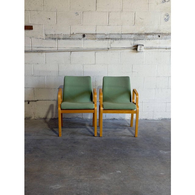 Beautiful pair of vintage Danish modern armchairs crafted in Denmark, featuring elegant bentwood frames with sculptural...