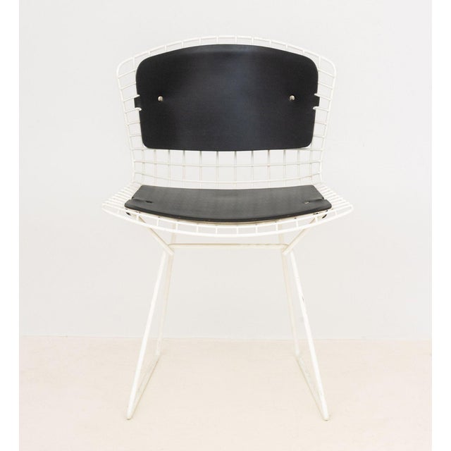 Harry Bertoia Style Wire Side Chair, white enamel frame with attached black cushions. 30" H x 21" W x 19" D; seat: 18" H....