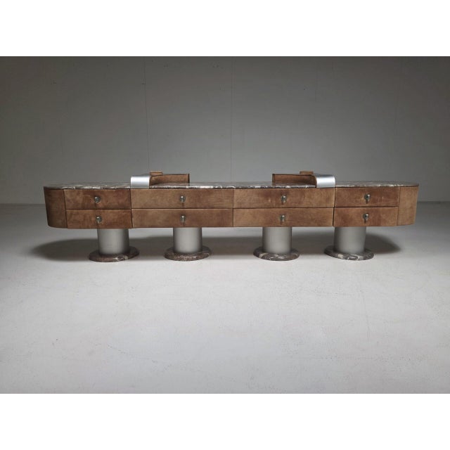 An exceptional Italian modular lowboard from the 1970s, defined by its bold architectural silhouette and luxurious...