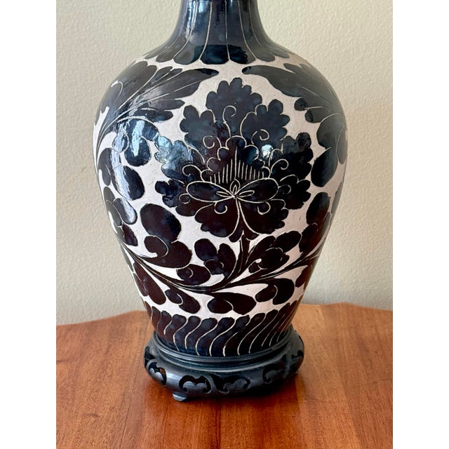 Asian midcentury Cizhou-inspired vase fitted as a lamp with a carved wood vase. All modern hardware and wiring. Please see...