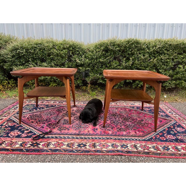 Pair of Mid Century Danish Modern Walnut Sculptural End Tables. These gorgeous tables feature a deep lipped round edging...
