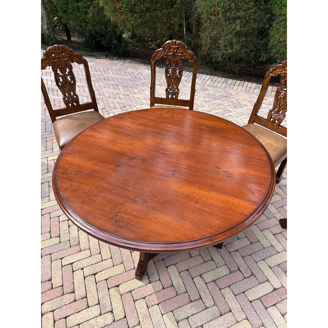 Gather around timeless design and enduring craftsmanship with this Woodland Round Solid Wood Dining Table. Beautifully...