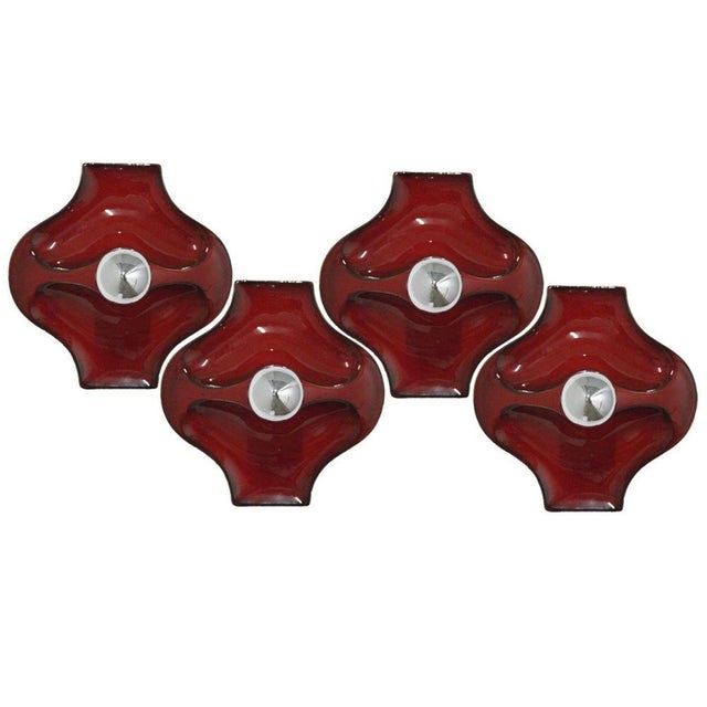 Red ceramic wall lights. Manufactured by Hustadt Leuchten Keramik, Germany in the 1970s. The glaze is in red. We used...