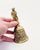 An elegant late 19th-century Belgian cast brass table bell, dating to circa 1890, richly decorated with sculptural relief...