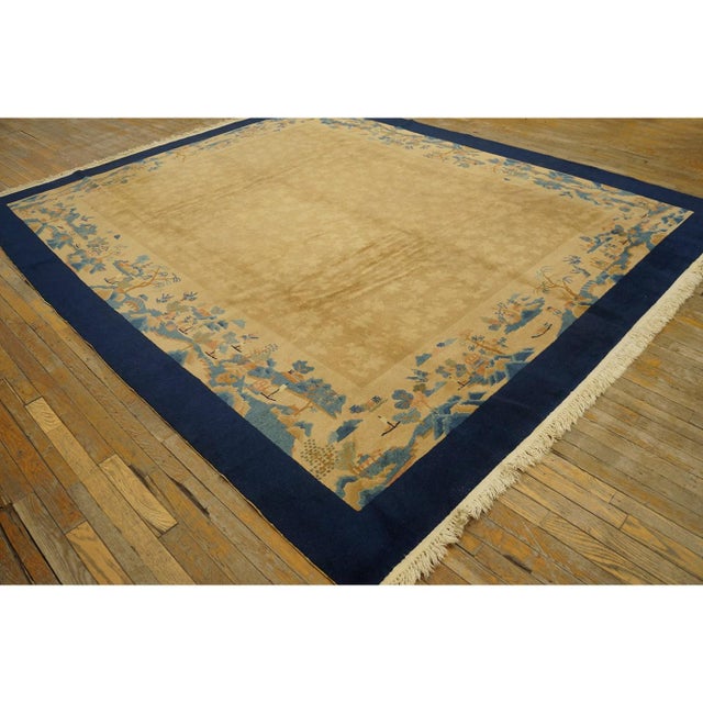 Antique Peking Chinese Floral Blue, Ivory Beige Cream White 1920s Rug, Circa Date: 1920s. This exquisite example of...