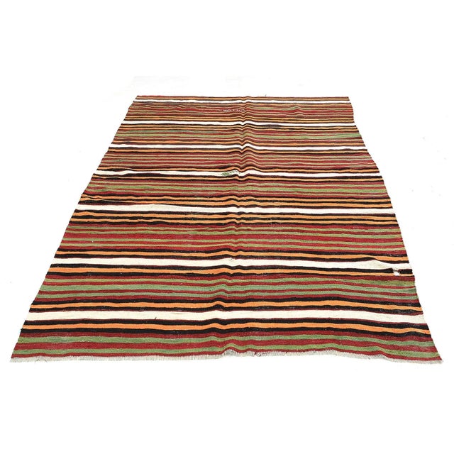 Handwoven vintage striped kilim rug from Denizli region of Turkey. Approximatelly 45-55 years old. In very good condition.