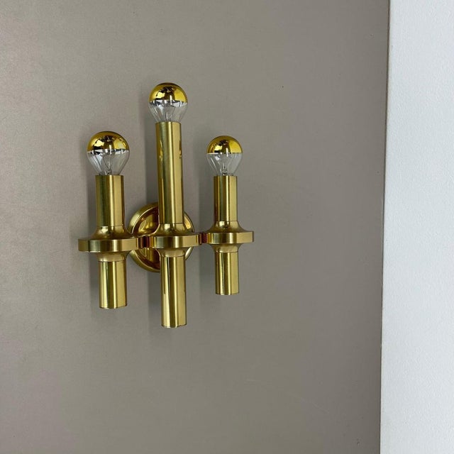 Article: wall light in brass design: gaetano sciolari origin: italy age: 1970s this modernist light was produced in italy...